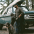 Filson Alaskan Guide Shirt Otter Green/Black Plaid lifestyle with dogs 