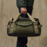 Filson All-Weather 40L Duffle Olive/Black/Covert carrying in hand