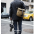 Filson Rugged Twill Field Bag Small Tan in the city with camera