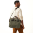 Filson Original Briefcase Otter Green wearing on shoulder