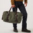 Filson Rugged Twill Duffle Bag Medium Otter Green carrying in hand close-up