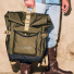Filson All-Weather Backpack Olive/Black/Covert carrying in hand