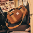 Filson Tin Cloth Duffle Bag Dark Tan in car