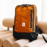 Topo Designs Global Travel Bag 30L Clay on sofa